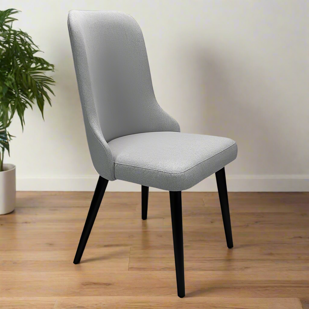 Gray upholstered chair with black legs on a white background