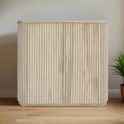 Beige woven basket with a ribbed texture on a white background