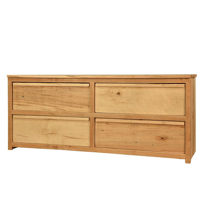 Wooden dresser with four drawers on a white background
