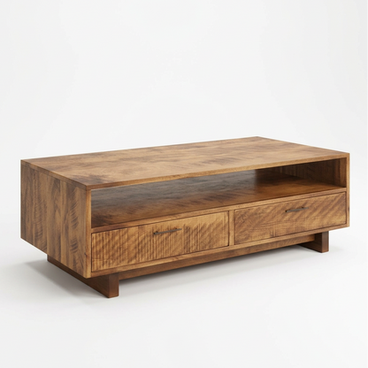 A rectangular wooden TV stand or coffee table with two front drawers and an open shelf, shown in a styled room with sunlight, a light wood floor, and a potted plant on the left.