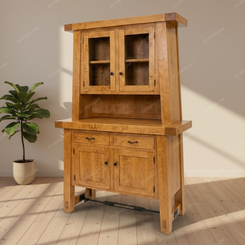 Wooden cabinet with glass doors and drawers on a wooden floor with a plant in the background