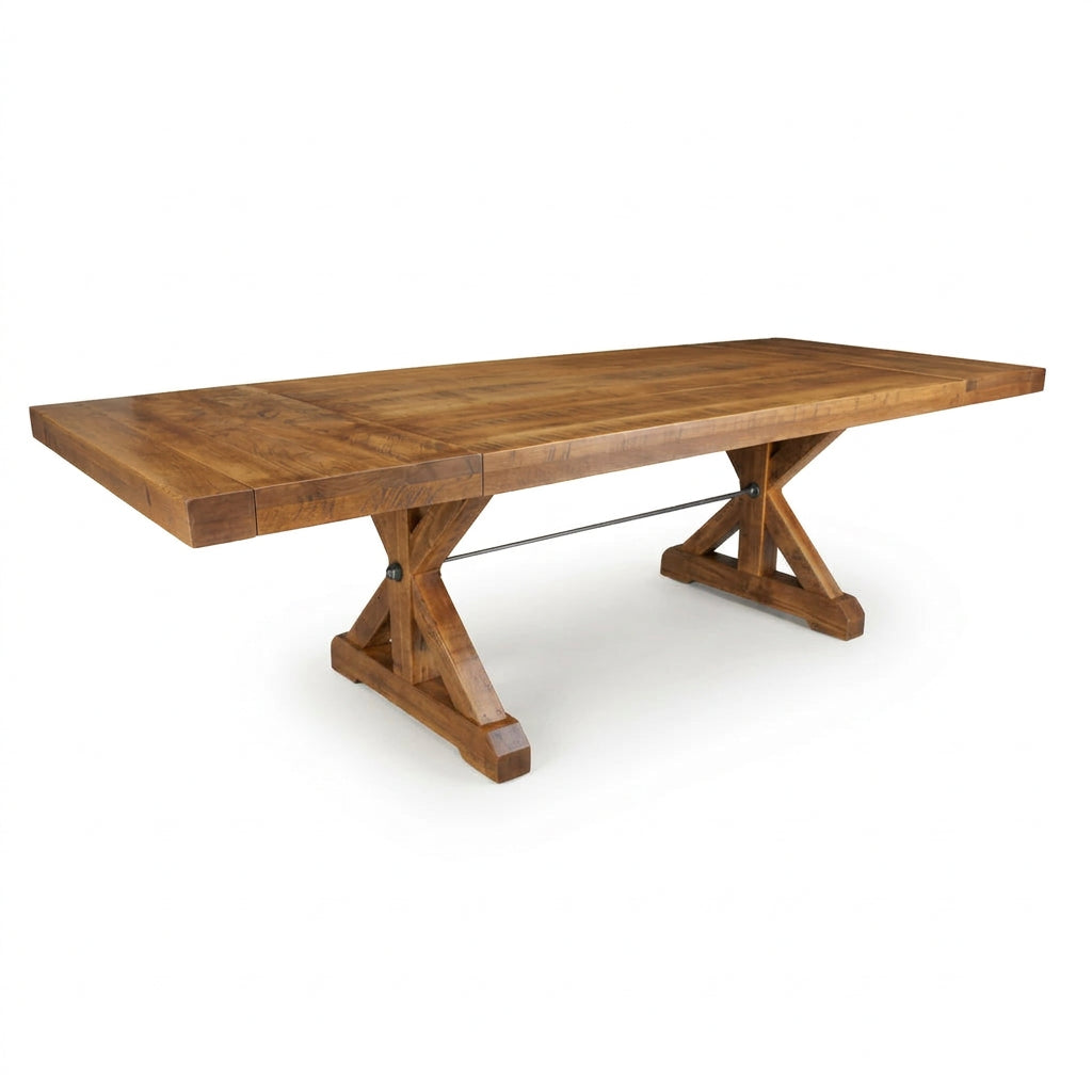 A rustic wooden dining table with a rectangular top and X-style trestle bases, shown on a plain white background.