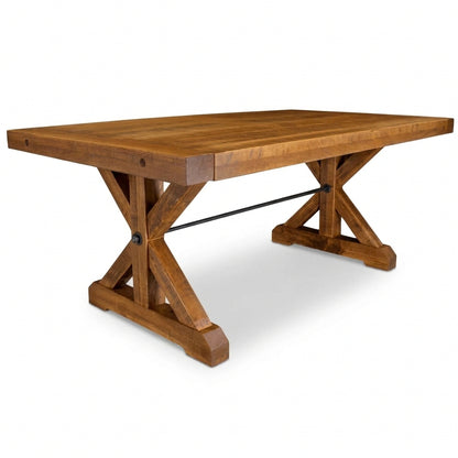 A rustic wooden dining table with a rectangular top and a trestle-style base, shown on a clean white background.