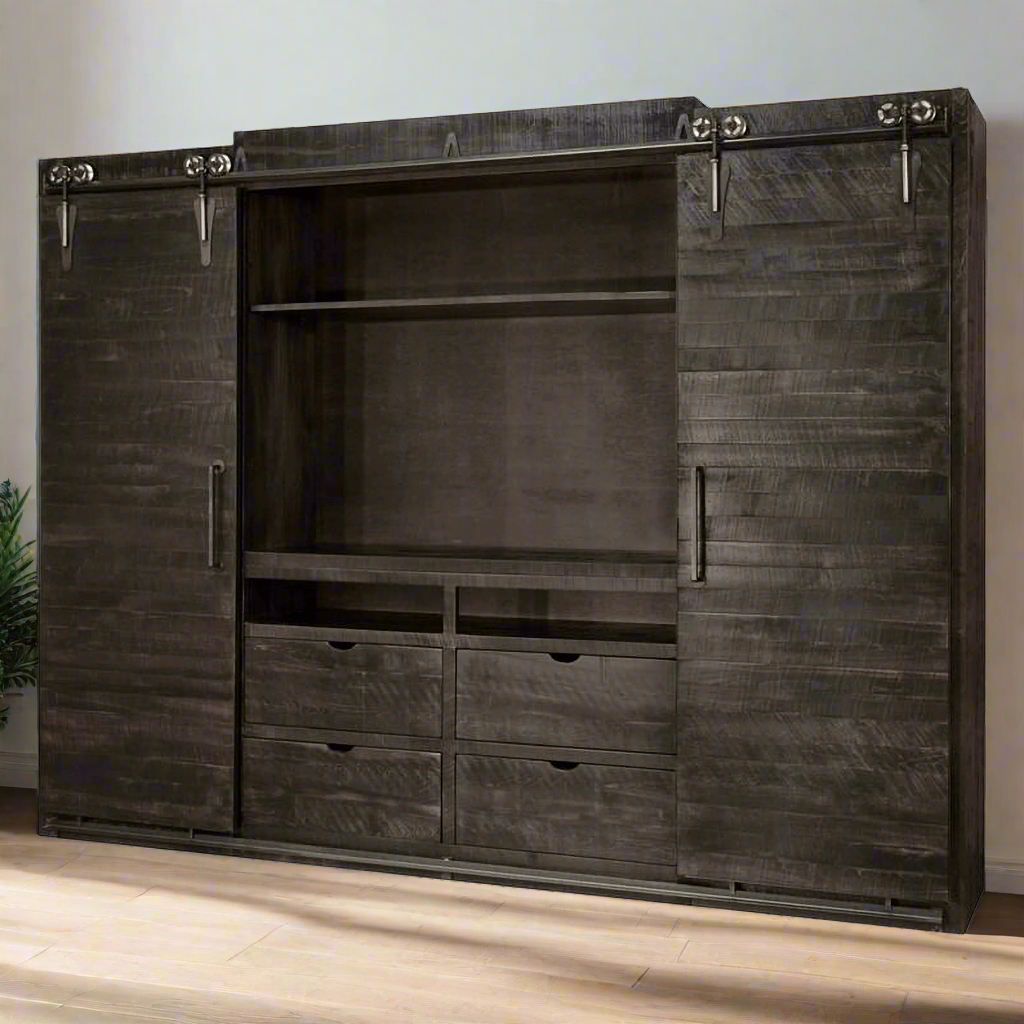 Dark wooden wall unit with sliding doors and drawers on a white background