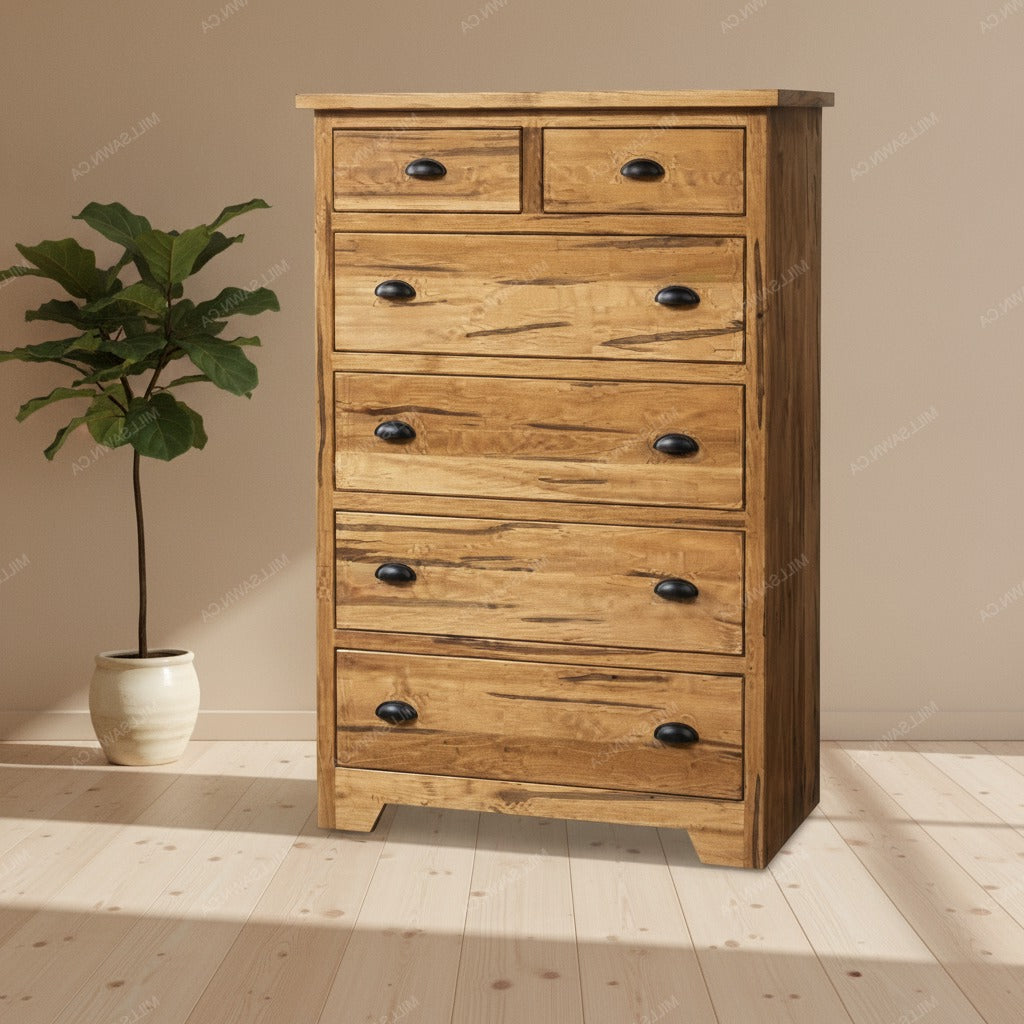 A rustic wooden 6-drawer chest of drawers with black metal knobs, set against a beige wall and light wood floor next to a potted green plant.