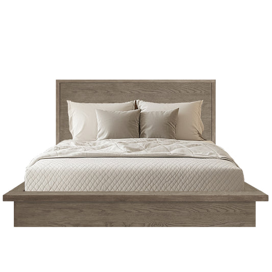Wooden bed with beige bedding and pillows on a white background