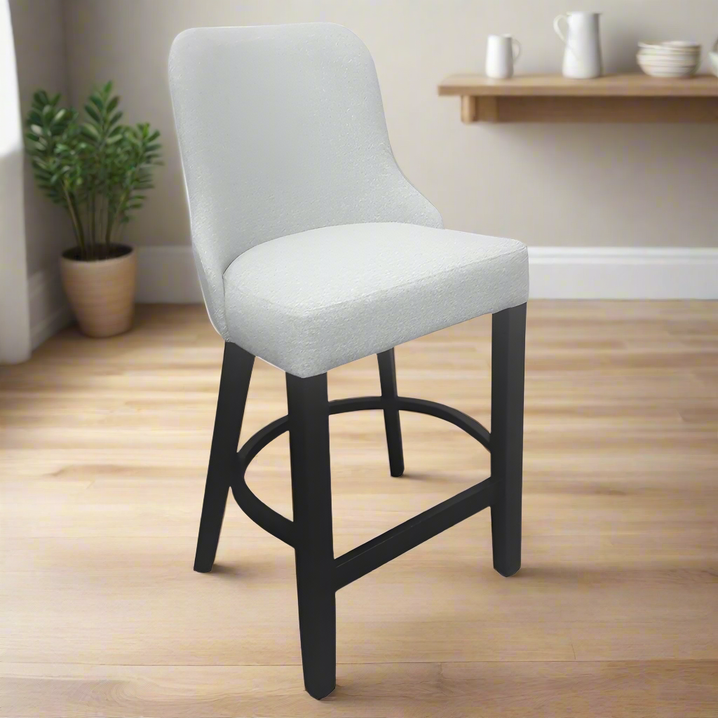 Gray cushioned bar stool with black legs on a white background