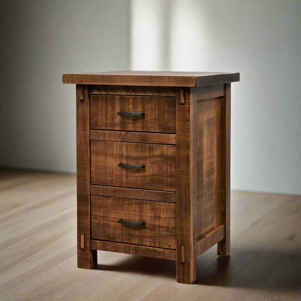 Wooden nightstand with three drawers on a white background