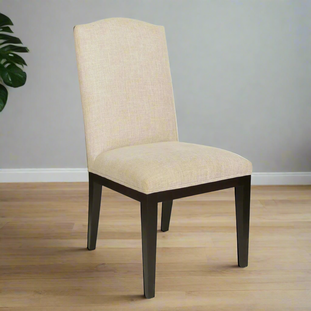 Beige upholstered chair with dark wooden legs on a white background