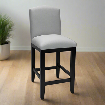 Bar stool with gray cushioned seat and backrest on a white background