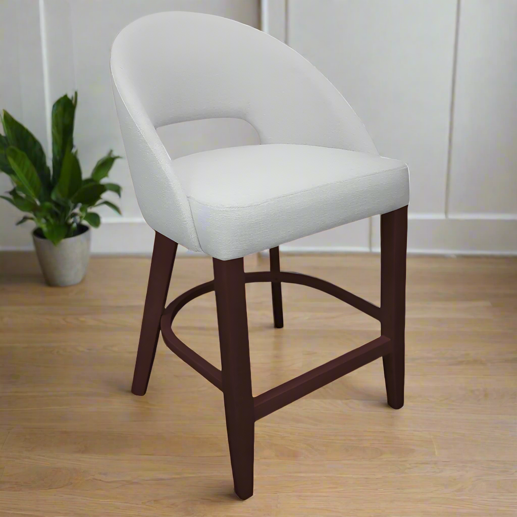 Bar stool with gray cushioned seat and wooden legs on a white background