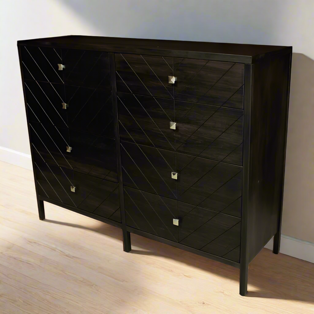 Dark wooden dresser with diamond pattern and metallic handles on a white background