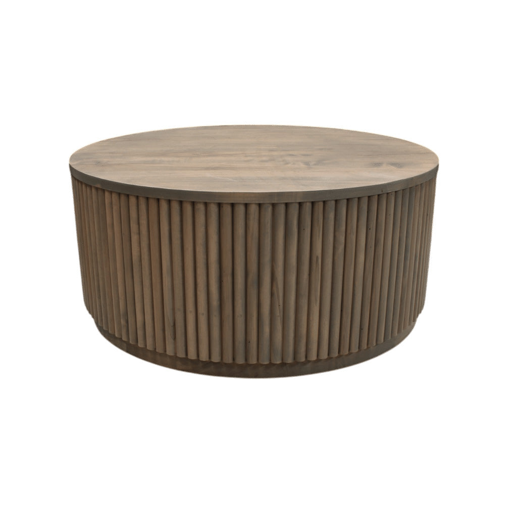 Round wooden coffee table with ribbed cylindrical design on a white background