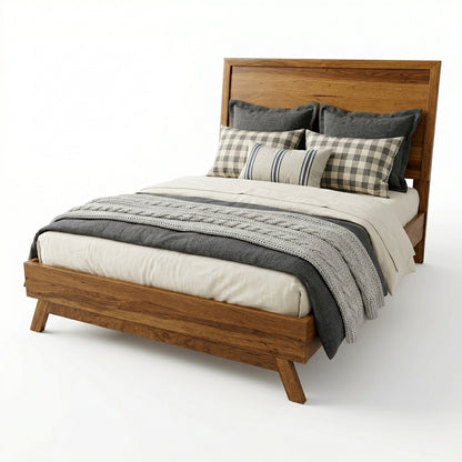 A mid-century modern wooden bed frame with a warm medium-brown finish, styled with neutral bedding, plaid pillows, and a gray cable-knit throw blanket on a clean white background.